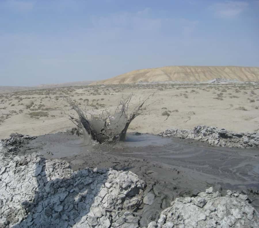 Baku:Gobustan Mud Volcanoes Temple & Entry tickets included - Yanar Dag brings natural fire to the hillside