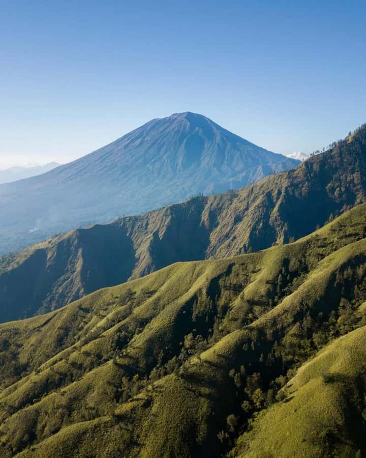 Bali: Caldera Sunrise Trek and Natural Hot Spring - Sunrise over four volcanic peaks