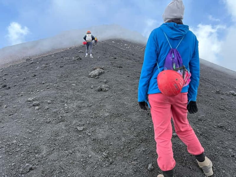 Catania: Mount Etna Adventurous Hiking Tour with Equipment - A lava tube and a playful descent
