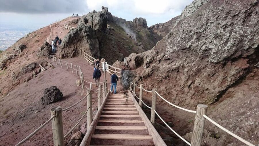 Day Trip to Pompeii & Vesuvius from Naples - Cancellation, languages, and booking details