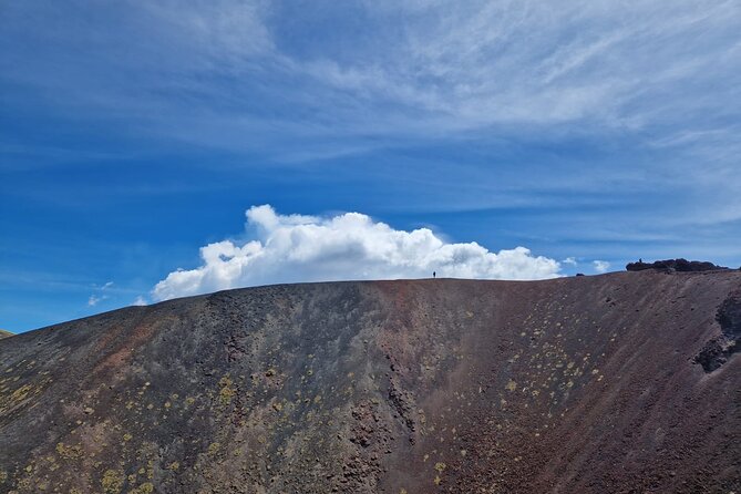 Etna Family Tour Excursion for families with children on Etna - Entering Grotta della Neve with a helmet and torch