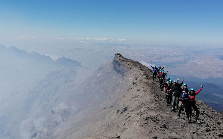 Etna: summit craters trekking with volcano guide 3350mt - Walking through black lava and lunar-like ground