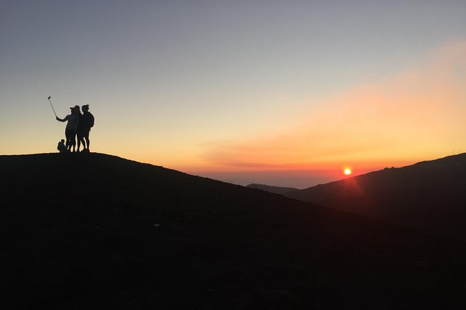 Etna Sunset Tour (starting from Catania) - Inside a rough lava cave with helmets and torches