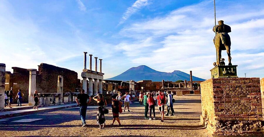 From Positano: Pompeii and Vesuvius Guided Tour - Walking through Pompeii with an English-speaking guide