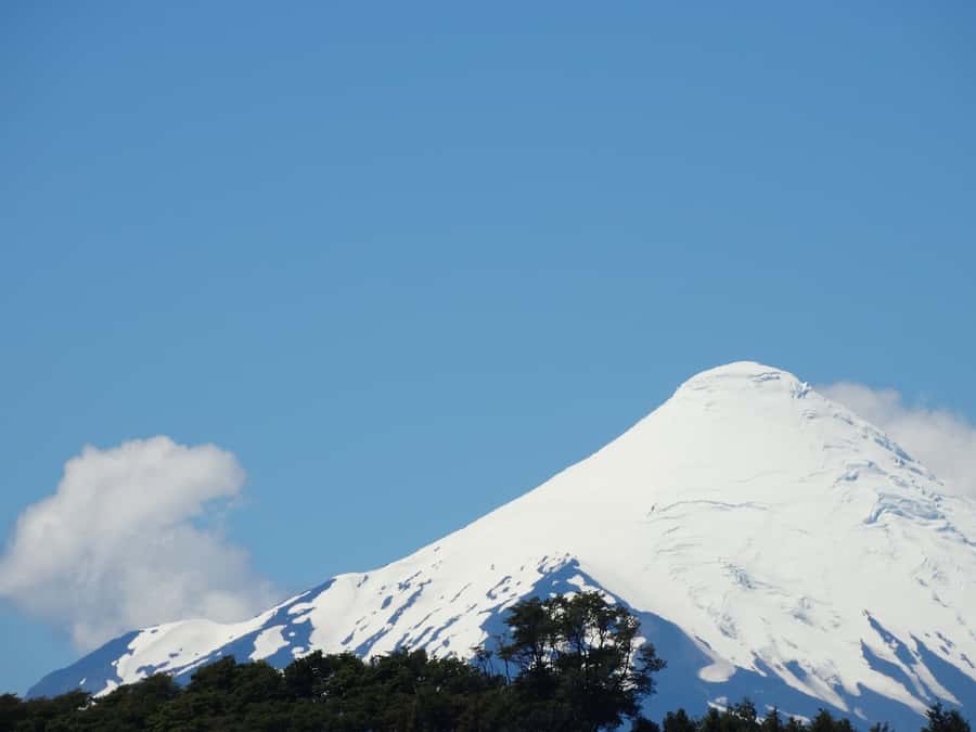 From Puerto Varas: Osorno Volcano & Petrohue Falls Day Tour - Petrohué Falls and the dark rock of old lava