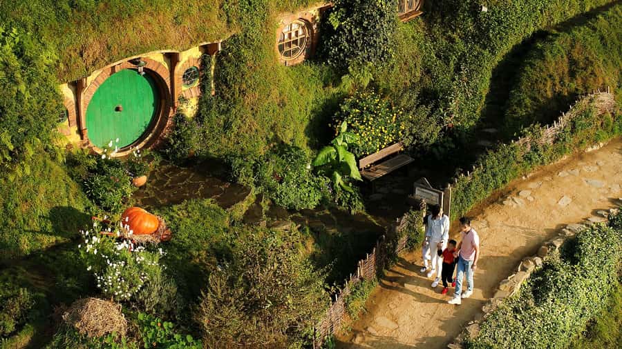 From Rotorua: Hobbiton Movie Set Tour with Festive Lunch - Walking through the 12-acre Hobbit village