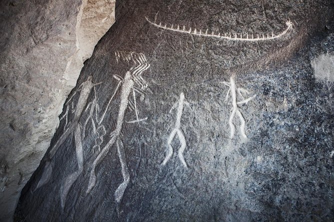 Gobustan National Park & Mud Volcanoes Tour - Reading the petroglyphs at Gobustan