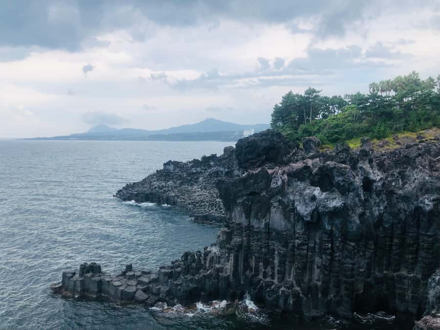 Jeju: Mt. Hallasan Hike and UNESCO Sites Day Tour - Cheonjiyeon Falls, where the water seems to come from the sky