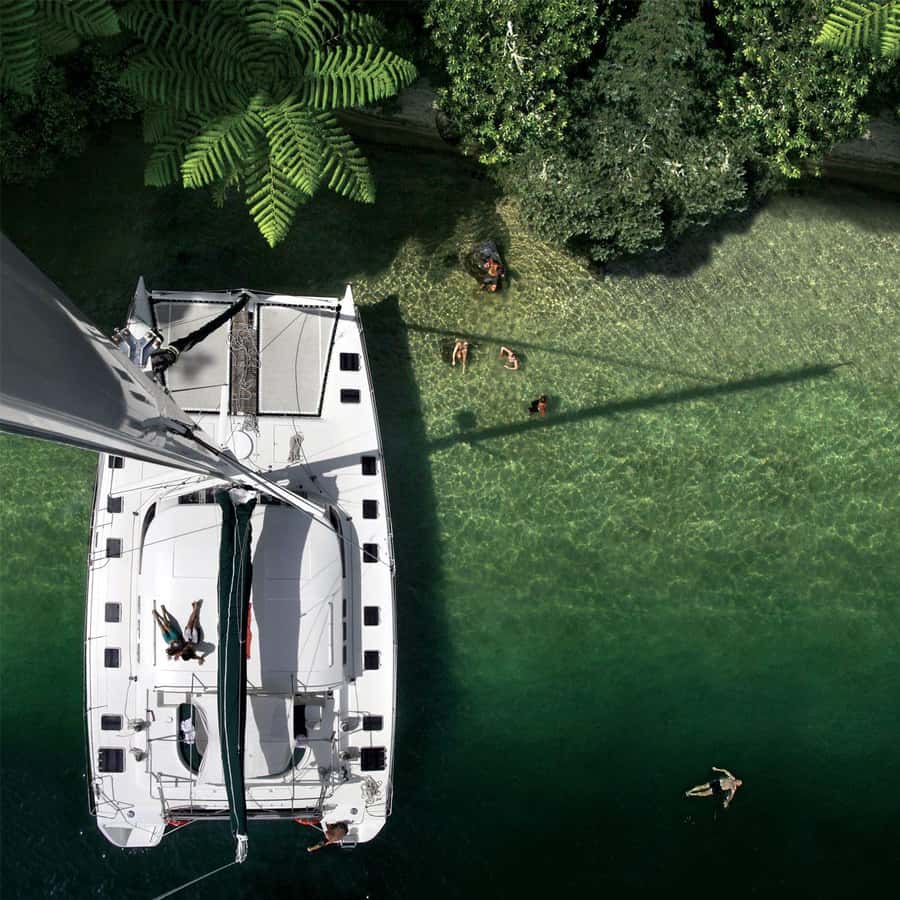 Lake Taupo: Luxury Sailing Catamaran to Māori Rock Carvings - A cold swim in clear lake water