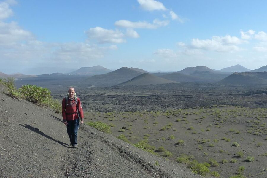 Lanzarote: Guided Volcano Hike with Transfers - Crossing hardened lava in Volcanos Natural Park