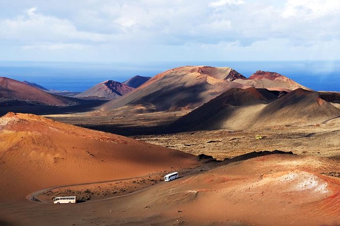 Lanzarote Volcano and Wine Region Tour from Fuerteventura - Riding the volcanic road through Timanfaya