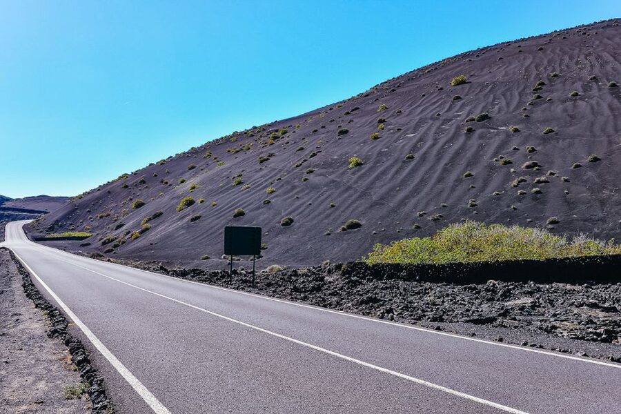 Lanzarote: Volcanos of Timanfaya and Caves Tour with Lunch - Through the palm valley to Jameos del Agua