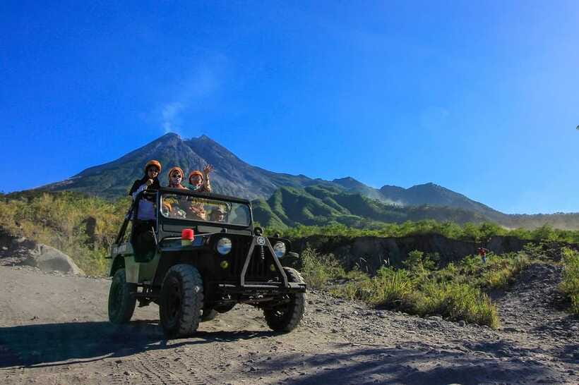 Merapi volcano sunrise with 4wd jeep and step on cold lava - The river crossing and mountain water