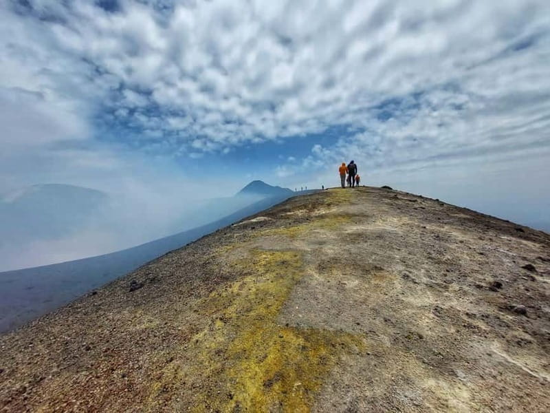 Mount Etna with pick-up and drop-off from Catania: 3000 meters with cable car and jeep - Walking Through a 100-Meter Lava Tunnel