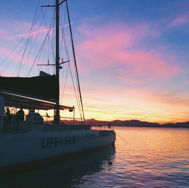 S'Arenal: Sunset Catamaran Cruise with BBQ - Watching the sunset near Palma Bay