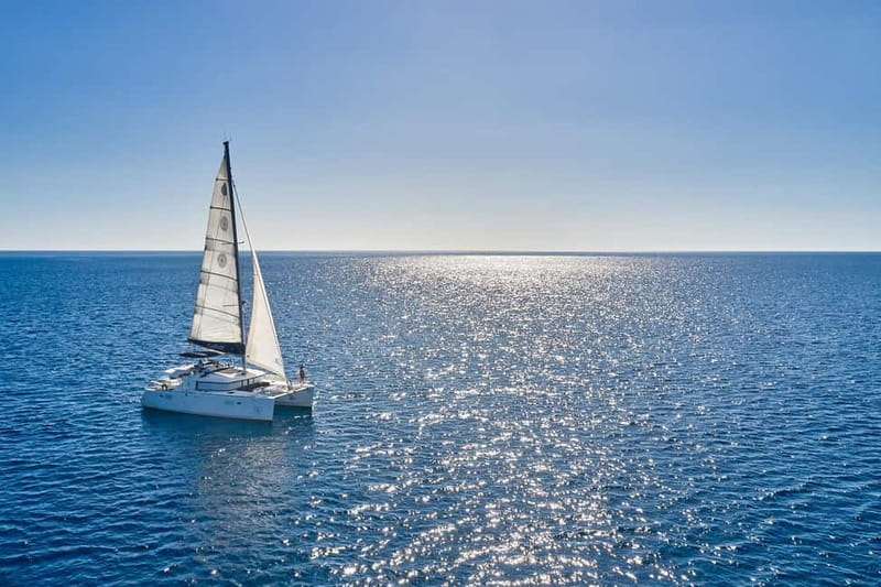 Santorini: Caldera Classic Catamaran Cruise w/ Meal & Drinks - Nea Kameni: black lava and sulfur water
