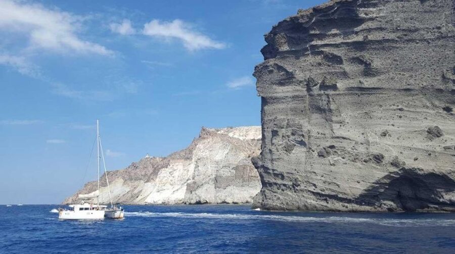Santorini: Caldera Cruise with Greek Meal and Transfer - Red Beach gives the cruise its first splash of color