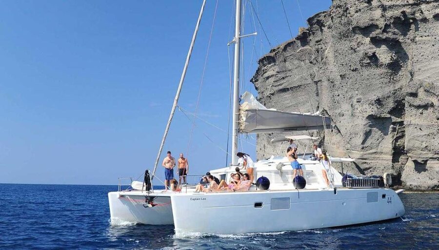 Santorini: Caldera Cruise with Greek Meal and Transfer - Palea Kameni and Nea Kameni show Santorini’s volcanic side