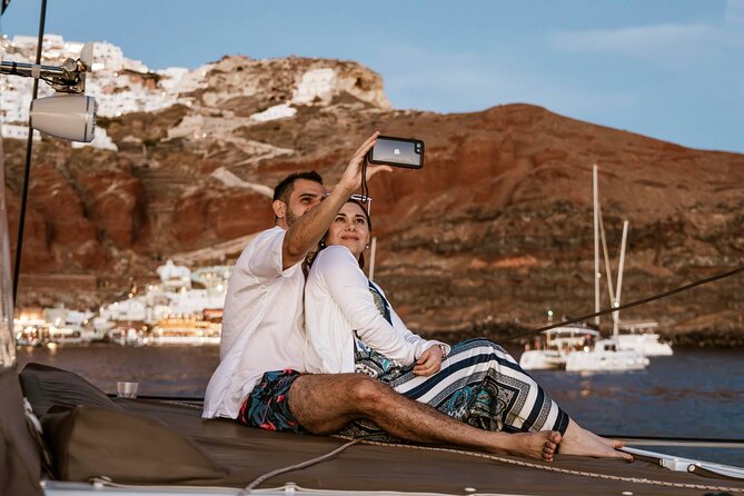 Santorini Catamaran Cruise with Greek Meal, Open-Bar and Sunset - The sunset finale and the weather question