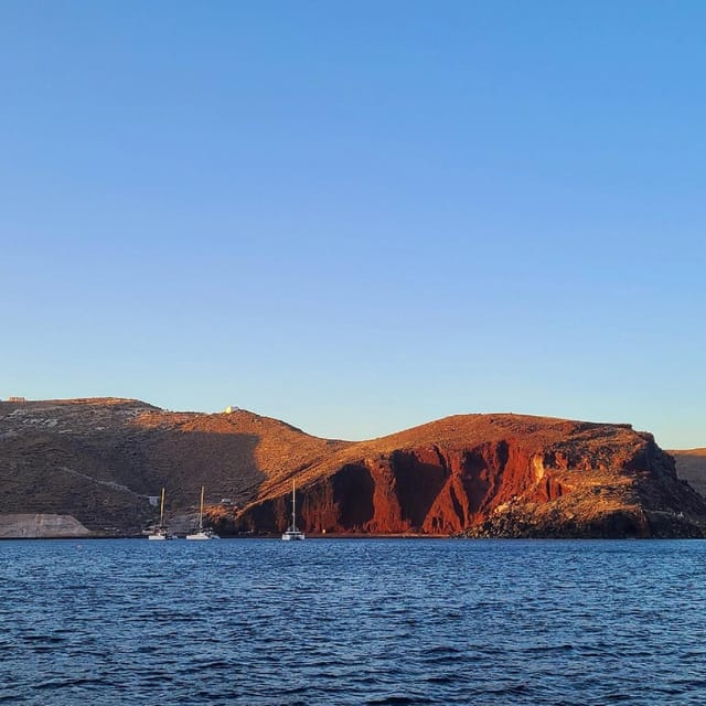 Santorini:Cruises with Catamaran around the Volcanic Island. - Red Beach and Santorini’s volcanic colors