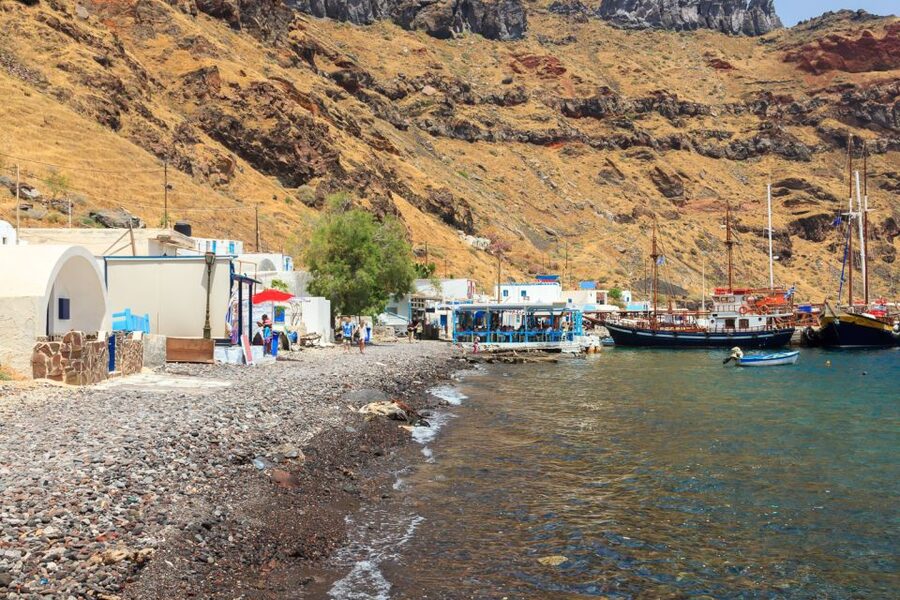Santorini Island Bus Tour and Caldera Sunset Cruise - Boarding at Athinios and heading toward the volcano