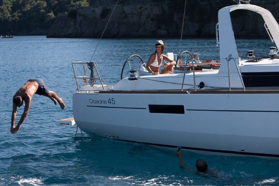 Santorini: Private Caldera Sailing Trip with Open Bar & Meal - Red Beach and the southern volcanic coast